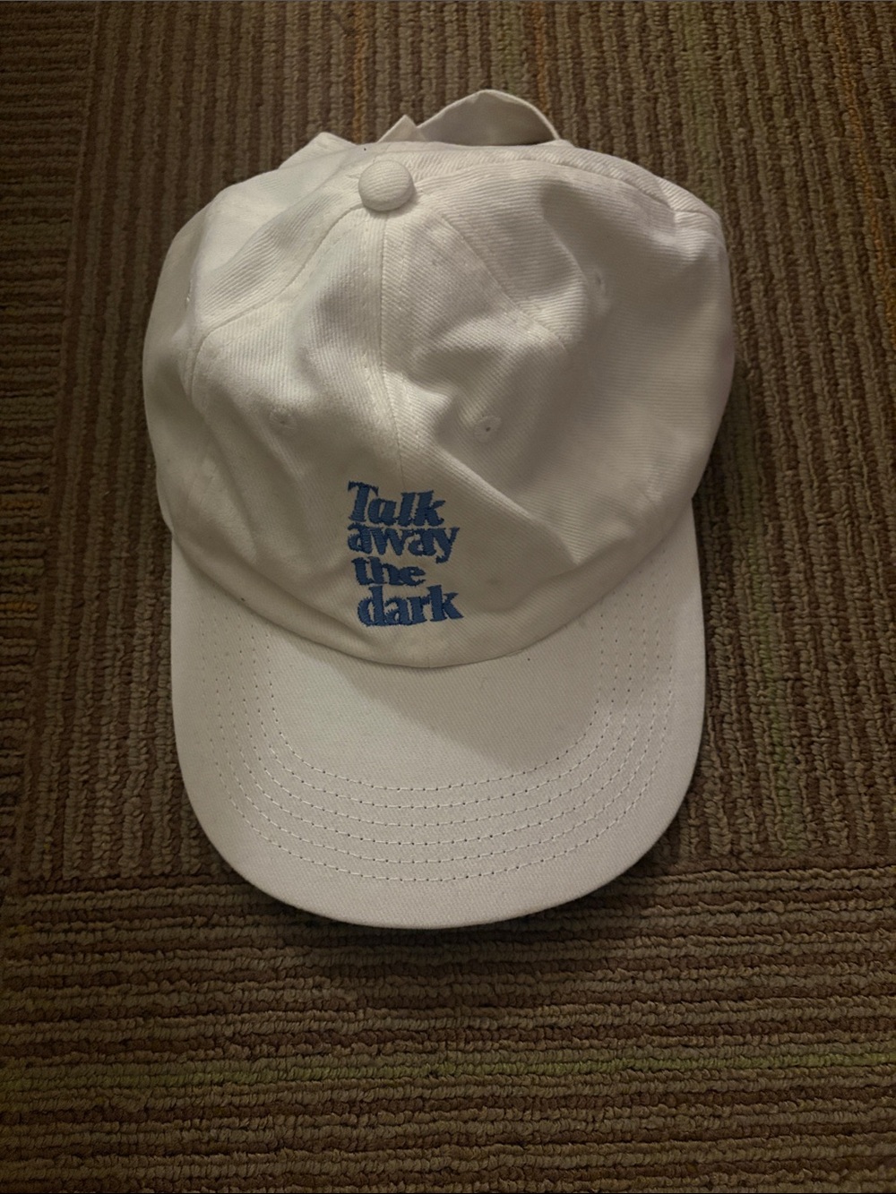 White Baseball Cap with Blue "Talk Away the Dark" Embroidery